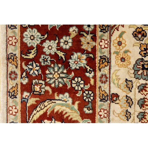 76 - An Islamic Turkish Silk Carpet with Silk Tassels  from the 20th Century.

Approximately 124cm x 77.5... 