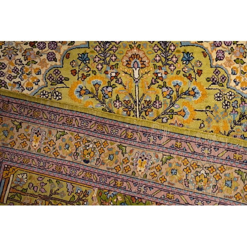 77 - A Persian Qum Hand-knotted Silk Rug from the 19th Century with a Floral Patterned Design.

Approxima... 