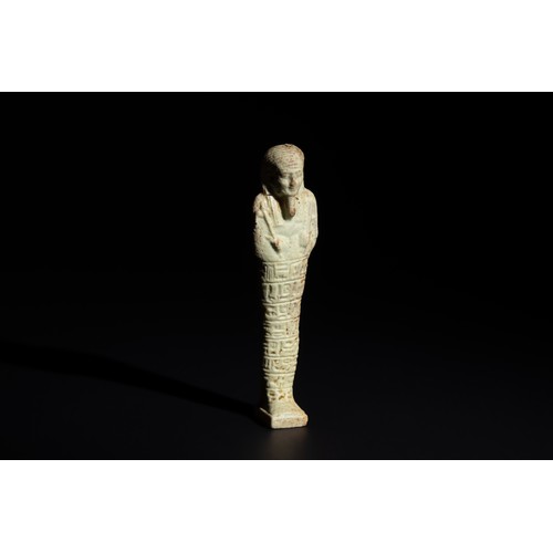 164 - An Egyptian Faience Ushabti Circa 625 B.C. Inscribed with Hieroglyphs.

H: Approximately 10.5cm

Pro... 