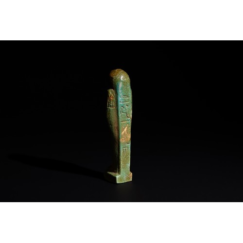 168 - An Egyptian Blue Glazed Faience Ushabti Circa Early 26th Dynasty.

H: Approximately 9cm

Provenance:... 