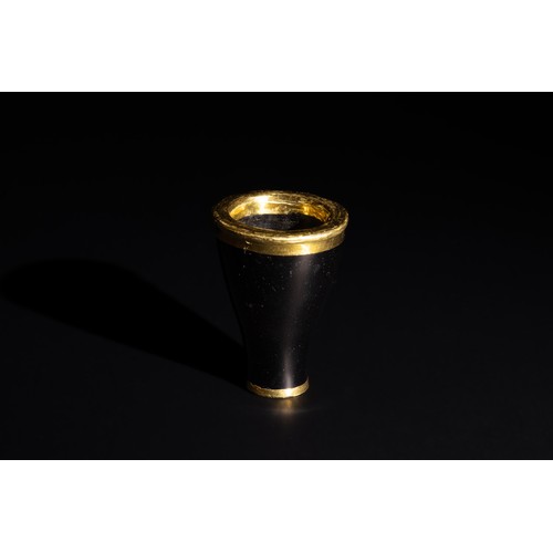 230 - A Possible Obsidian Gold Framed Cup, Probably Hellenistic Period. 

H: Approximately 6cm

Provenance... 