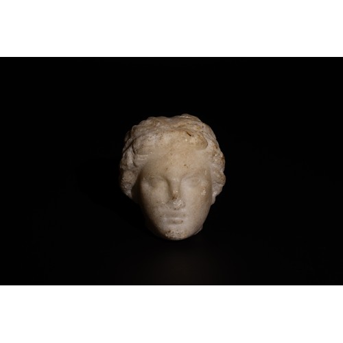 231 - A Roman Alabaster/ Marble Head of a Young Girl Circa 2nd-3rd Century A.D.

H: Approximately 7.7cm

P... 