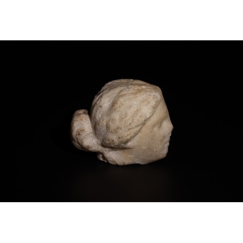 231 - A Roman Alabaster/ Marble Head of a Young Girl Circa 2nd-3rd Century A.D.

H: Approximately 7.7cm

P... 