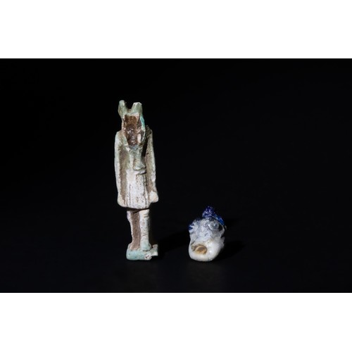 238 - A Lot of a Roman Glass Theoretical Mask Pendant & A Roman Standing Faience Amulet.

H of Head: Appro... 