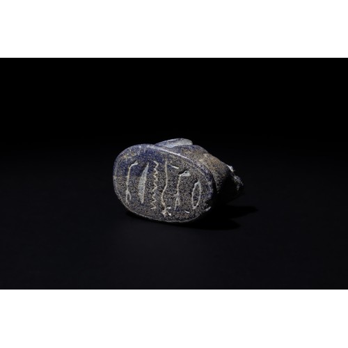 185 - An Egyptian Lapis Lazuli Seated Frog Amulet, Inscribed with Hieroglyphics, 1300 B.C.-600 B.C.

L: Ap... 