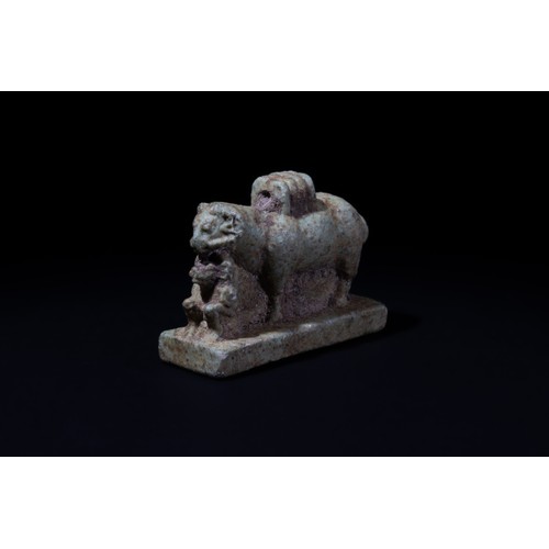 186 - An Egyptian Faience Ram Amulet with a Seated Baboon In Front, Ptolemaic Period.

H: Approximately 3.... 