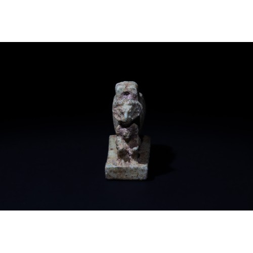 186 - An Egyptian Faience Ram Amulet with a Seated Baboon In Front, Ptolemaic Period.

H: Approximately 3.... 