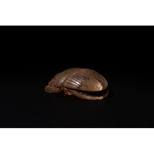 190 - An Egyptian Rock Crystal Scarab in the Form of a Pendant, Early Ptolemaic Period.

L: Approximately ... 