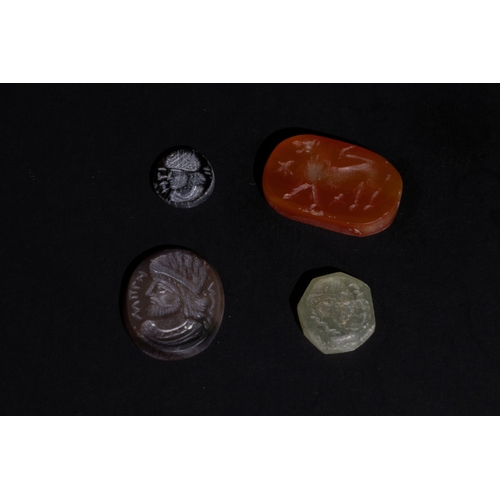 7 - **NO RESERVE**

A Lot of 4 Near Eastern Intaglio Stones for Rings.

L: Approximately 0.6cm - 2cm

Pr... 