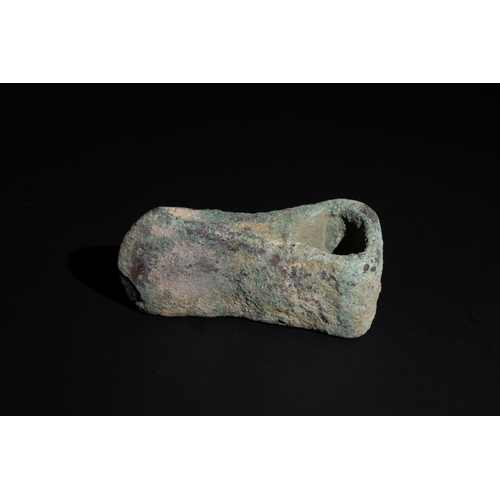 241 - A Luristani Bronze Axehead with a Broad Triangular Shaft Hole Circa 1200-800 B.C.

Approximately 9.7... 