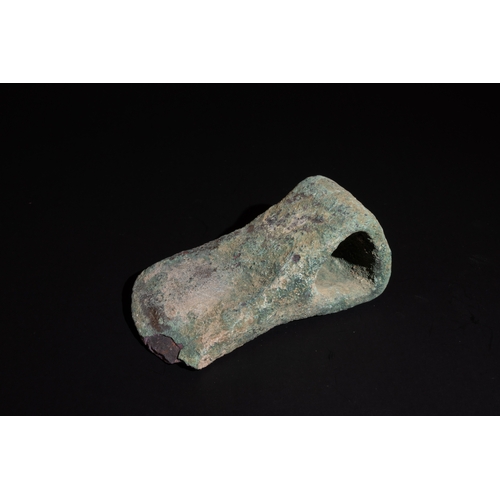 241 - A Luristani Bronze Axehead with a Broad Triangular Shaft Hole Circa 1200-800 B.C.

Approximately 9.7... 