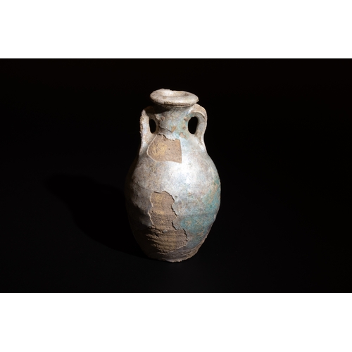 10 - **NO RESERVE**

A Near Eastern Doublehanded Pottery Jar with Turquoise Glaze Circa 9th-10th Century.... 