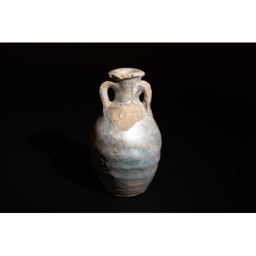 10 - **NO RESERVE**

A Near Eastern Doublehanded Pottery Jar with Turquoise Glaze Circa 9th-10th Century.... 