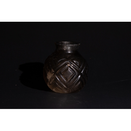 108 - A Rare Islamic Carved Crystal Bottle Possibly Fatimid

H: Approximately 5.5cm