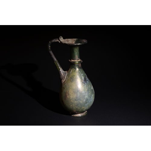 256 - A Roman Pale Green Glass Jug Circa 4th Century.