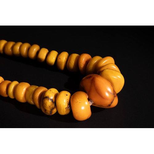 109 - An Islamic Tribal Yemeni Single Strand Amber Beads Necklace.

212g