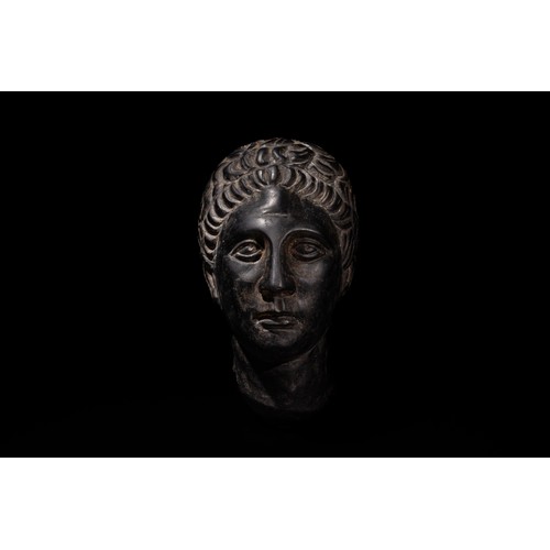 258 - A Roman Style Hardstone Head of a Young Lady, 2nd Century or Later.

H: Approximately 9.5cm

Provena... 