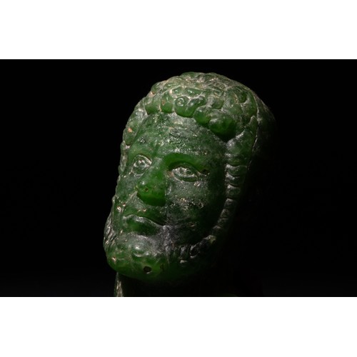 260 - A Roman Green Stone Bust of a Roman Deity/ Ruler, 2nd-3rd Century A.D.

H: Approximately 6.2cm

Prov... 