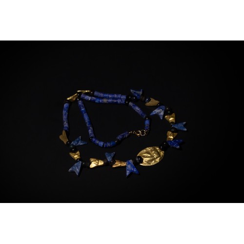 208 - An Egyptian Necklace Consisting of Different Period Lapis Lazuli & Gold Beads and Amulets.

15.5g

P... 