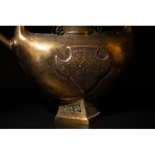 135 - An Islamic Indian Bronze Ewer Decorated with Intricate Openwork and Floral Patterns.

H: Approximate... 