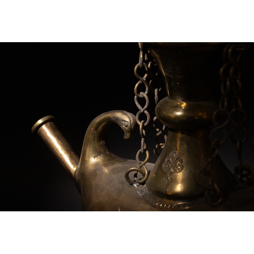 135 - An Islamic Indian Bronze Ewer Decorated with Intricate Openwork and Floral Patterns.

H: Approximate... 