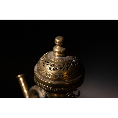 135 - An Islamic Indian Bronze Ewer Decorated with Intricate Openwork and Floral Patterns.

H: Approximate... 