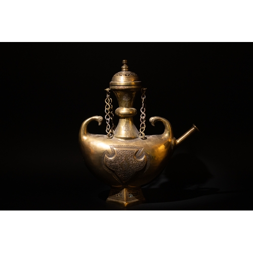 135 - An Islamic Indian Bronze Ewer Decorated with Intricate Openwork and Floral Patterns.

H: Approximate... 