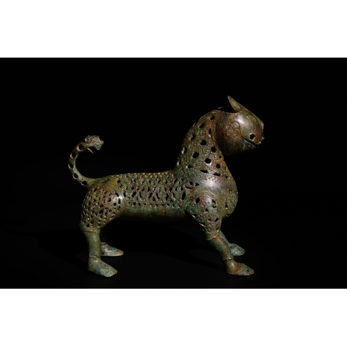 139 - An Islamic Bronze Lion Decorated with Intricate Openwork.

H: Approximately 27.5cm
L: Approximately ... 