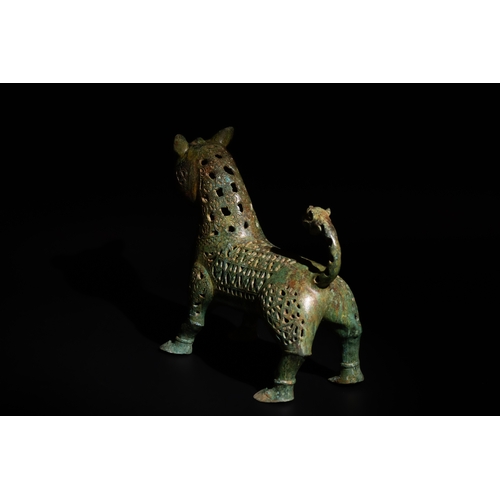 139 - An Islamic Bronze Lion Decorated with Intricate Openwork.

H: Approximately 27.5cm
L: Approximately ... 