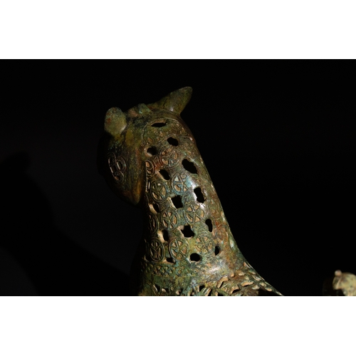 139 - An Islamic Bronze Lion Decorated with Intricate Openwork.

H: Approximately 27.5cm
L: Approximately ... 