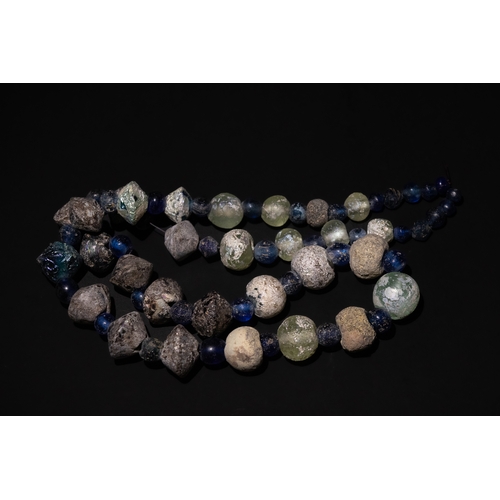 264 - A Roman Glass Beads Necklace, with Lovely Patina.

Half Breaded Length: Approximately 35cm