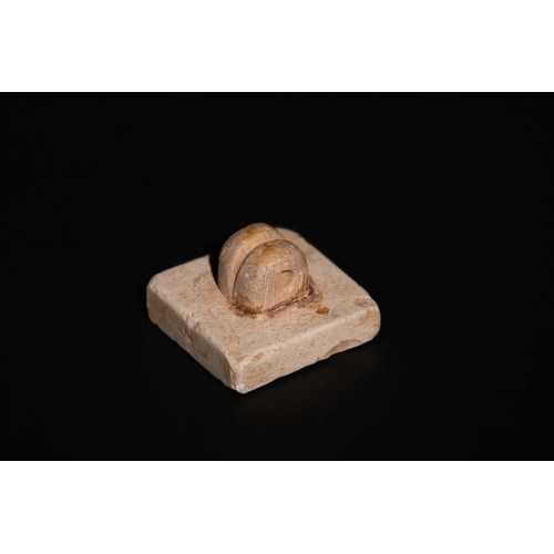 276 - A Terracotta  Stamp Seal in the Style of the Indus Valley.

Approximately 3.3cm x 3.3cm