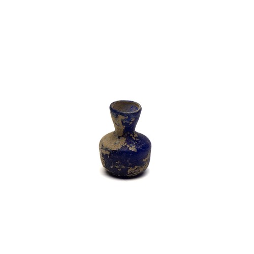 62 - An Islamic Blue Glass Bottle, 11-12th Century.

H: Approximately 5.5cm