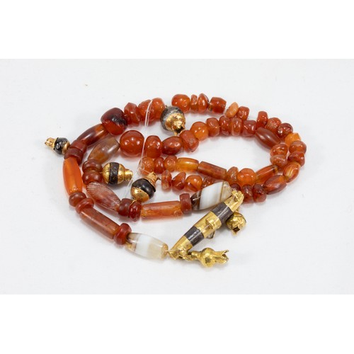 68 - A Roman Carnelian Necklace with a Gold Pendant Decorated with Garnet Stones from 625 BC- 476 AD.

Ha... 