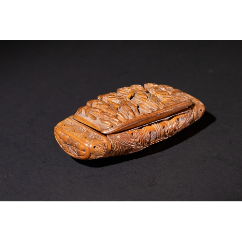 3 - A European Carved Coquilla Nut Snuff, 18-19th Century, Carved with 8 Men.

Approximately 10cm x 5cm
... 