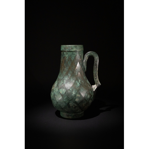 74 - A Late Sassanian - Early Islamic Period Bronze Ewer with Diamond-Shaped Cut Patterns, 6th-7th Centur... 