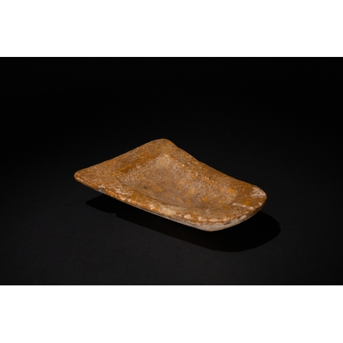 77 - A Stone Fragment from a Mould, Archaic Greek Period, 700-600 B.C.

L: Approximately 14.7cm