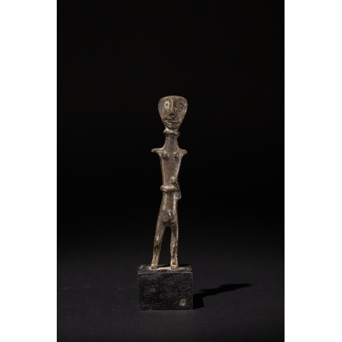 78 - A Luristani Bronze Sculpture of a Standing Man, 1st Millennium B.C. (800-2000 B.C.), Mounted on a St... 