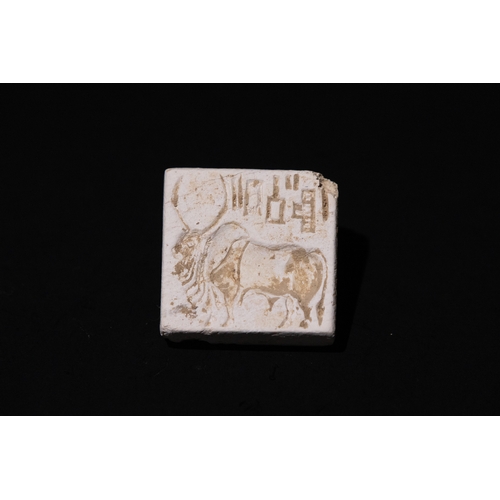 84 - An Indus Valley Steatite Seal Depicting a Bull and Inscriptions, 3300-1300 BCE.

Approximately 3.2cm... 