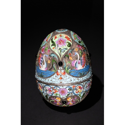 9 - A Russian 84 Standard Silver & Cloisonné Enamel Egg with a Silver Stand.

H: Approximately 12cm (wit... 