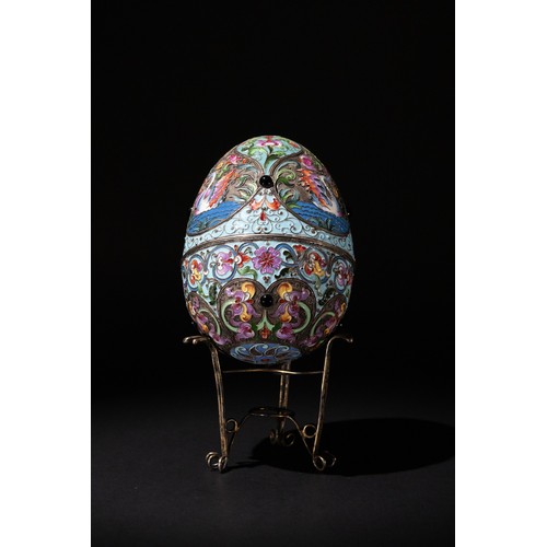 9 - A Russian 84 Standard Silver & Cloisonné Enamel Egg with a Silver Stand.

H: Approximately 12cm (wit... 