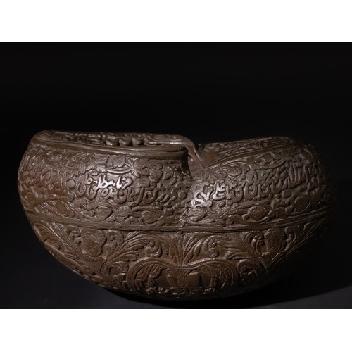 301 - An Islamic Persian Coco Kashkul Beggar's Bowl, Engraved with Islamic Calligraphy & Floral Motifs. 

... 