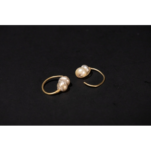 124 - A Pair of Islamic Gold Earrings with Pearls, 12th Century.

2.6g