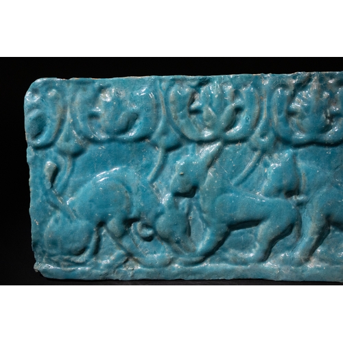 304 - An Islamic Kashan Turquoise Glazed Pottery Tile, 12th Century, Decorated with Felines.

Approximatel... 