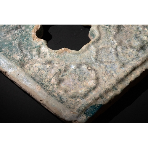 305 - An Islamic Persian Turquoise Glazed Pottery Tile, 13-14th Century.

Approximately 35cm x 29.5cm

Pro... 