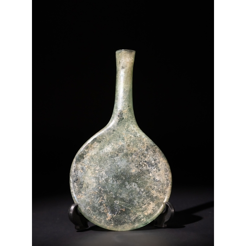 89 - A Roman Glass Pilgrim Flask, Circa 3rd-4th Century A.D.

H: Approximately 16cm