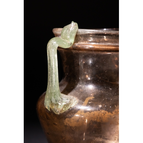 90 - A Roman Aubergine Glass Jar with Green Twin Handles, 3rd-4th Century.

H: Approximately 9cm