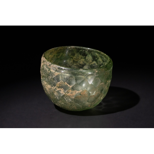 92 - A Sassanian Green Hemispherical Cut Glass Bowl, with Wheel-Cut Facets, Circa 5th-6th Century A.D.

D... 