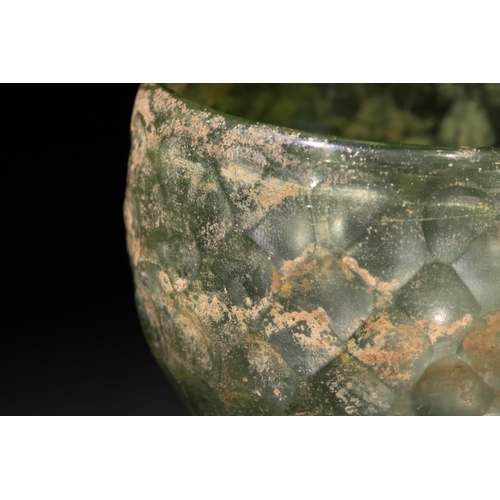 92 - A Sassanian Green Hemispherical Cut Glass Bowl, with Wheel-Cut Facets, Circa 5th-6th Century A.D.

D... 