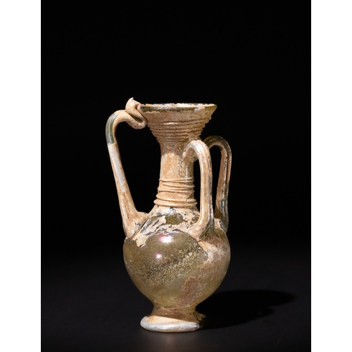 96 - A Roman Glass Four-Handled Flask, Circa 4th-5th Century A.D.

H: Approximately 10.9cm